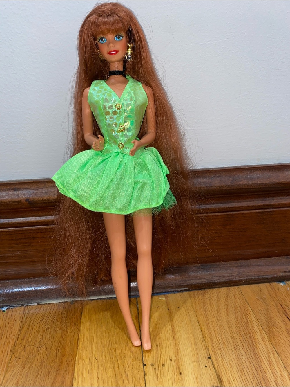 90s Barbie Teresa dressed in a Green Party dress